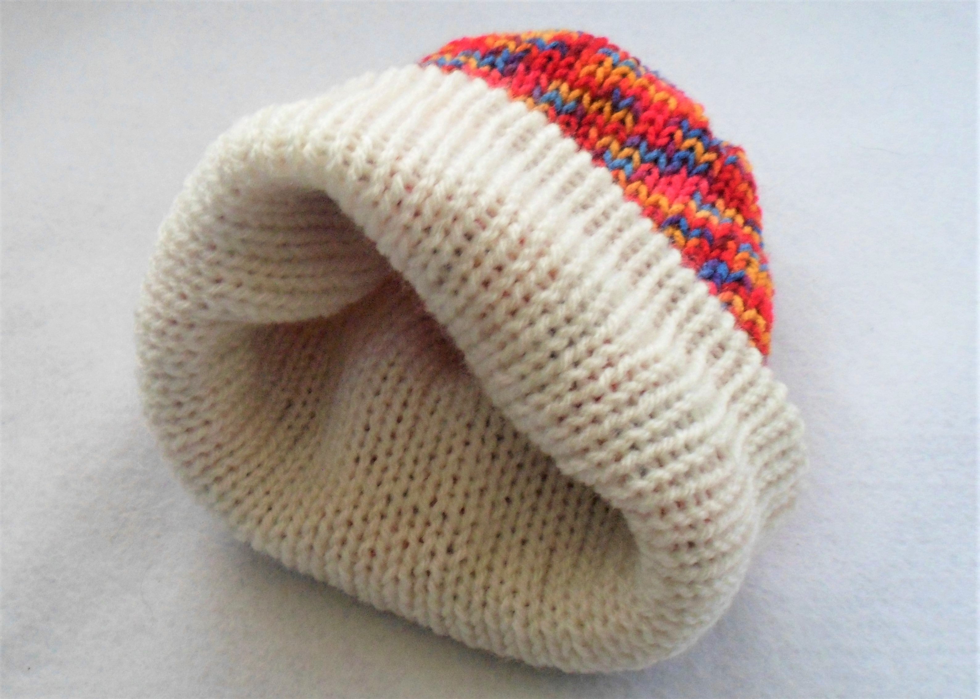 Knitted Plain White/Rainbow Variegated Reversible Hat - Tully Crafts